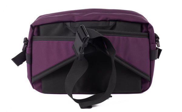 The LGD in Aubergine. Back view of the bag, showing the hideaway hip belt.